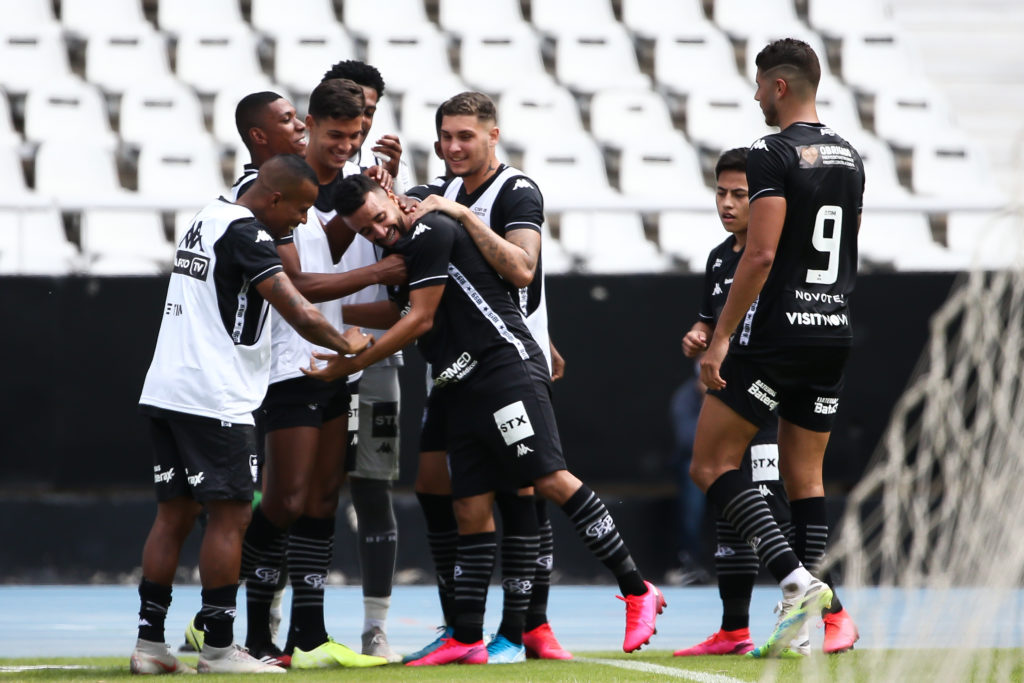 RIO DE JANEIRO, BRAZIL - JUNE 28: Caio Alexandre of Botafogo celebrates with his teammates after scoring the sixth goal of his team during the match between Botafogo and Cabofriense as part of the Carioca State Championship at Nilton Santos Stadium (aka Engenhao Stadium) on June 28, 2020 in Rio de Janeiro, Brazil. The match is played behind closed doors and further precautionary measures against the coronavirus (COVID - 19) Pandemic. (Photo by Buda Mendes/Getty Images)