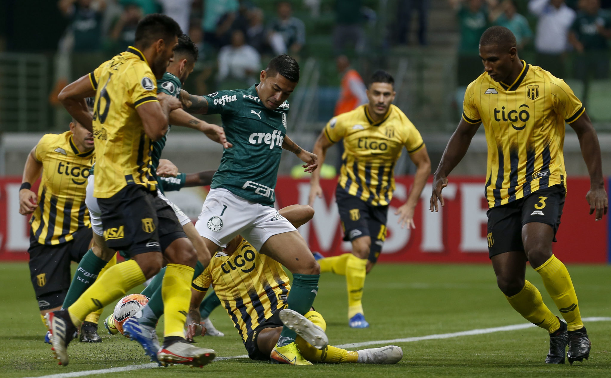 Brazil's Palmeiras player Dudu (C) vies for the ball with Paraguays Guarani players during their Copa Libertadores football match at Arena Palmeiras stadium, in Sao Paulo, Brazil, on March 10, 2020. (Photo by Miguel SCHINCARIOL / AFP) (Photo by MIGUEL SCHINCARIOL/AFP via Getty Images)