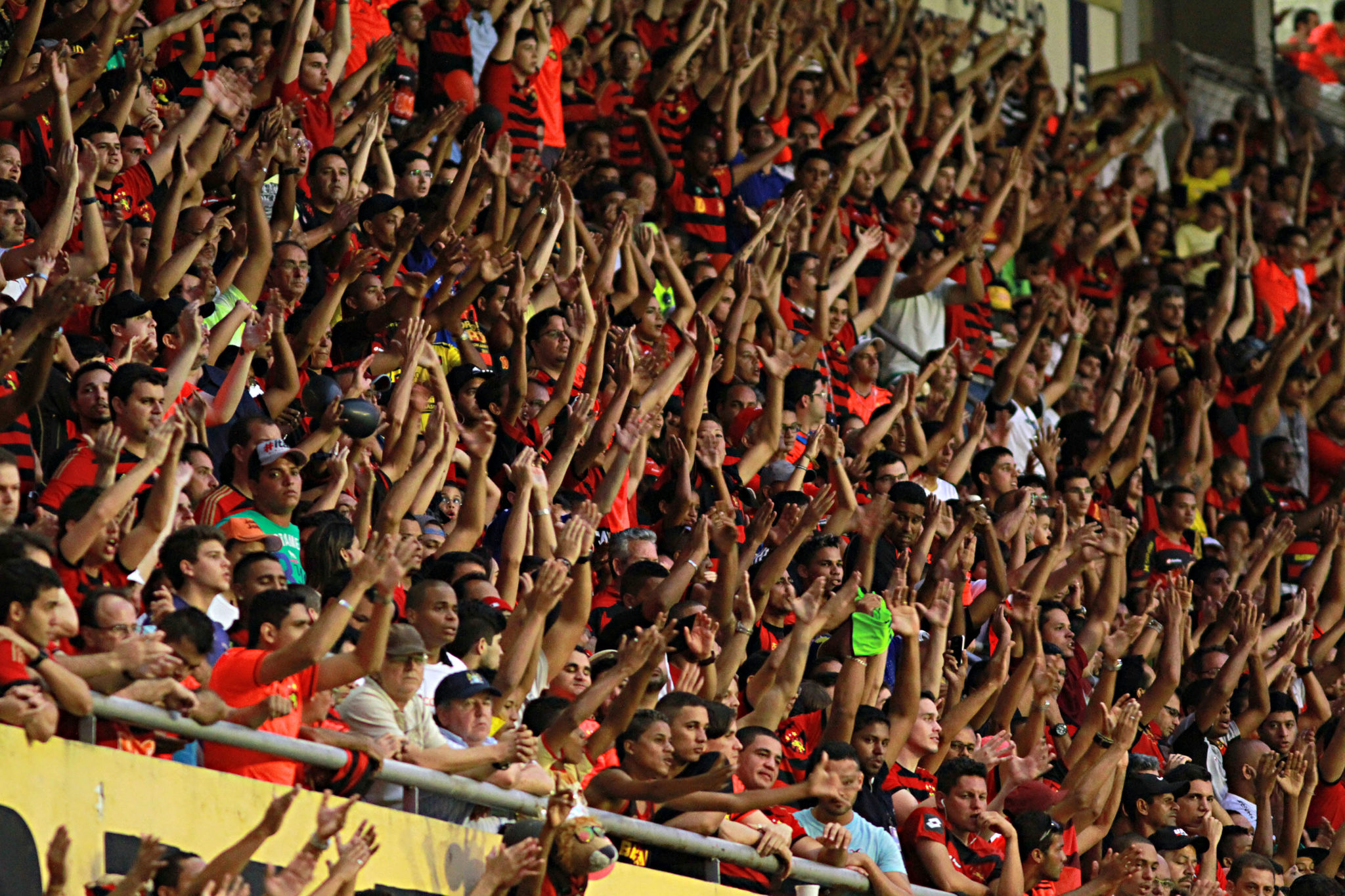 RECIFE, BRAZIL - NOVEMBER 2: Fans of Sport Recife celebrate a pelnaty during the Brasileirao Series A 2014 match between Sport Recife and Figueirense at Ilha do Retiro Stadium on November 2, 2014 in Recife, Brazil. (Photo by Renato Spencer/Getty Images)