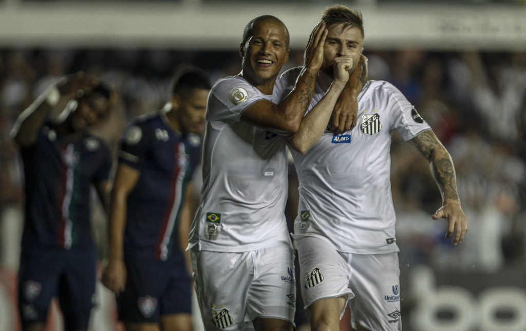 SANTOS, BRAZIL - MAY 02: Eduardo Sasha (R) of Santos celebrates after scoring his team's first goal with teammate player Carlos Sanchez during the match between Santos and Fluminense for the Brasileirao Series A 2019 at Vila Belmiro Stadium on May 02, 2019 in Santos, Brazil. (Photo by Miguel Schincariol/Getty Images)